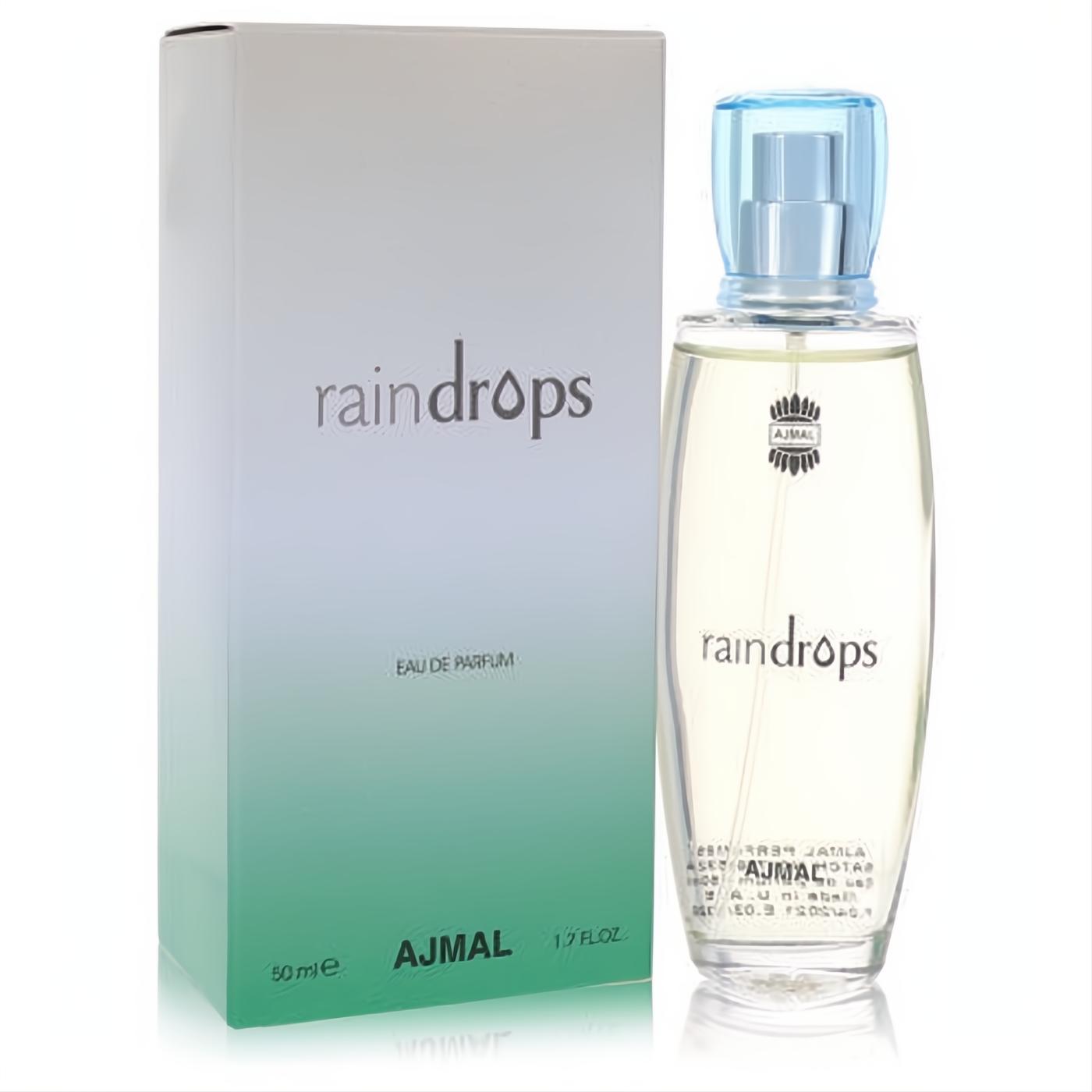 Elegant Ajmal Raindrops 1.7 oz Eau De Parfum: clear glass bottle with light blue cap, alongside its fresh white-to-green box.