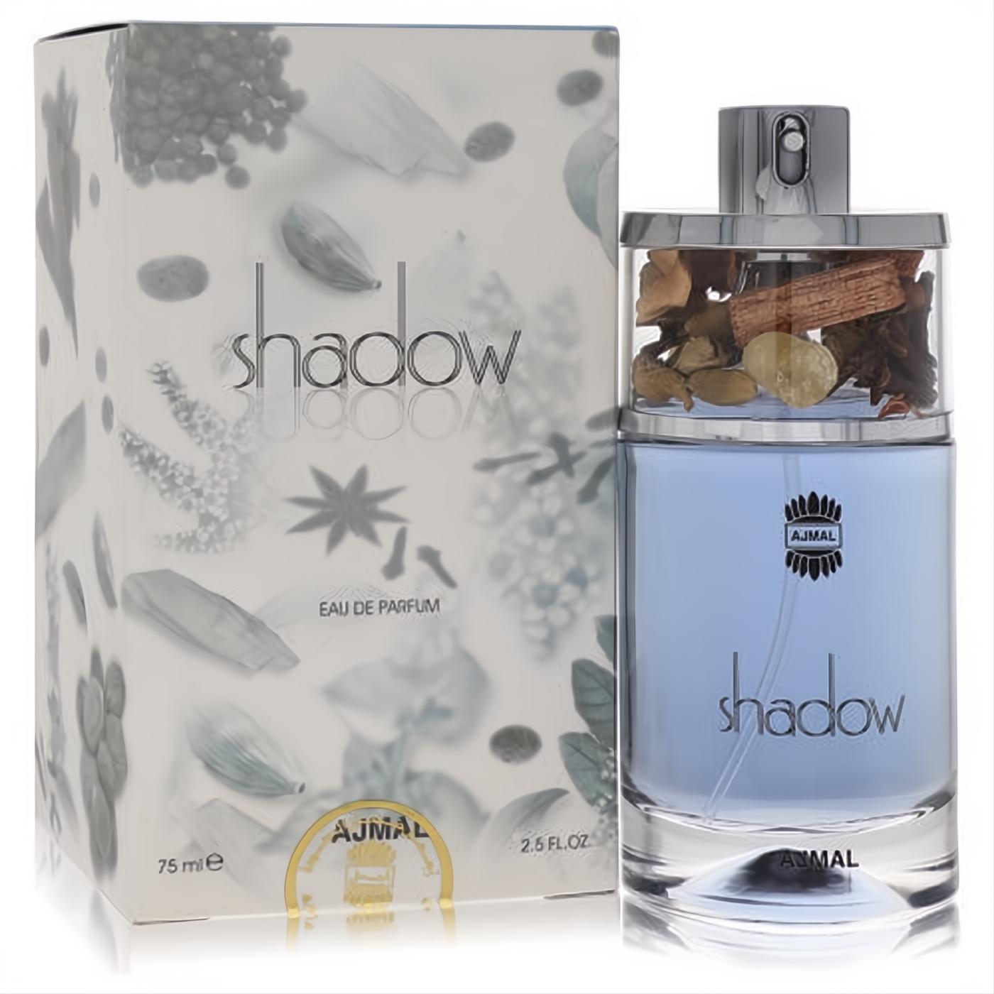 Ajmal Shadow men's cologne: sleek light blue glass bottle with a unique silver cap featuring botanicals, beside its elegant white box.