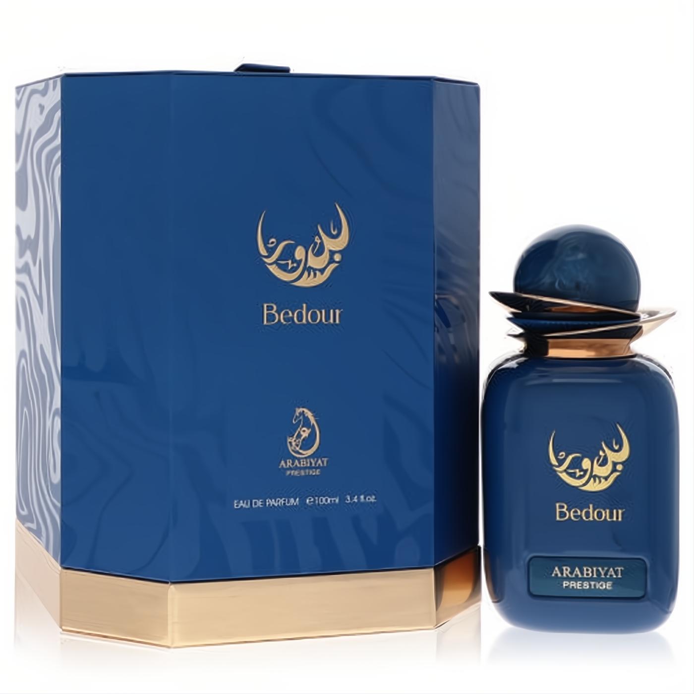 Arabiyat Prestige Bedour 3.4 oz unisex Eau De Parfum. Luxurious dark blue bottle with gold details and elegant hexagonal packaging.