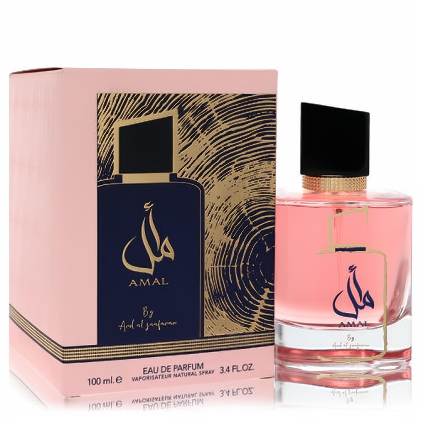 Ard Al Zaafaran Amal 3.4 oz unisex EDP. Elegant pink fragrance in clear bottle, beside its luxurious pink box with gold Arabic design.