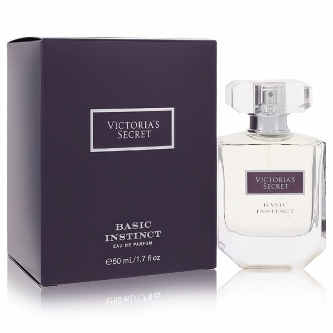 Victoria's Secret Basic Instinct 1.7 oz Eau De Parfum. Elegant clear glass bottle with faceted cap and matching dark plum box.