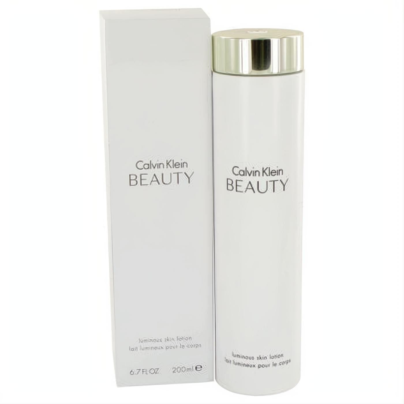 Indulge in Calvin Klein Beauty 6.7 oz luminous body lotion. Sleek white bottle, elegant metallic cap, and matching box.