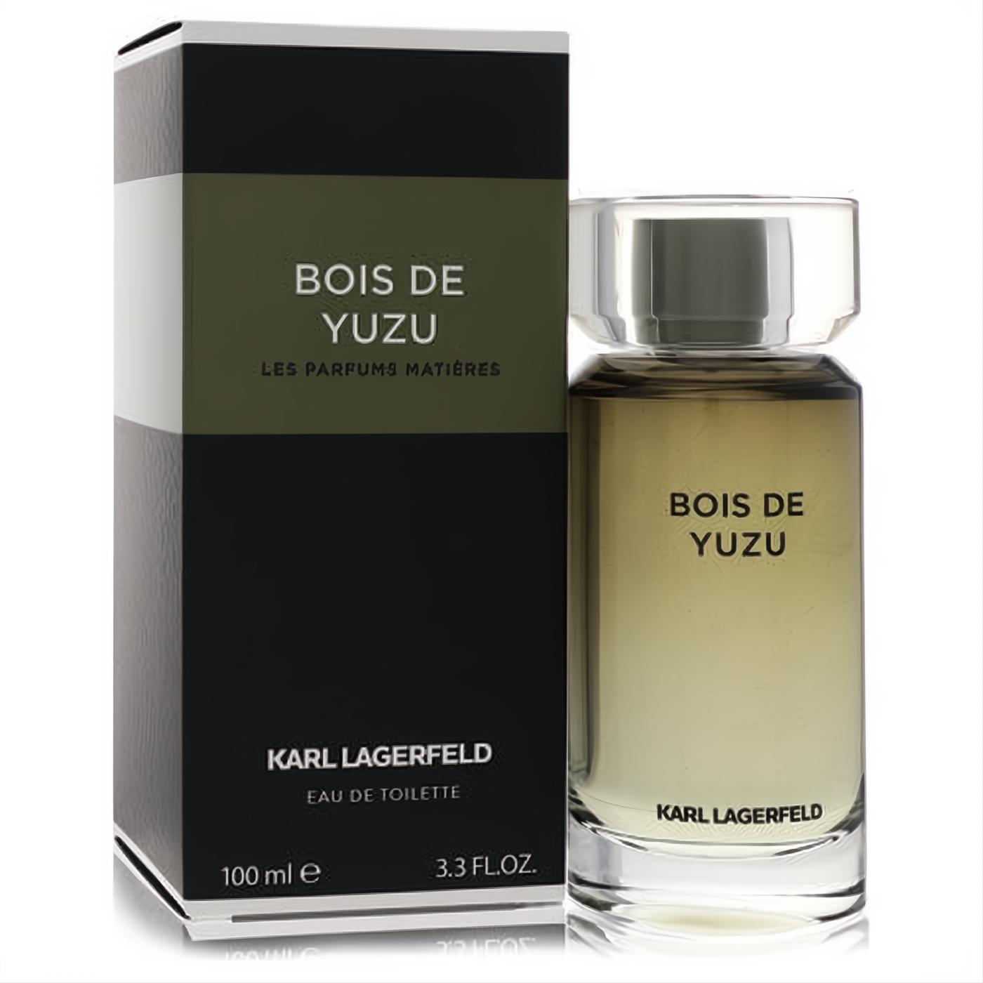 Karl Lagerfeld Bois De Yuzu 3.3 oz EDT. Clear bottle with golden fragrance and silver cap, beside its sleek black and olive green box.