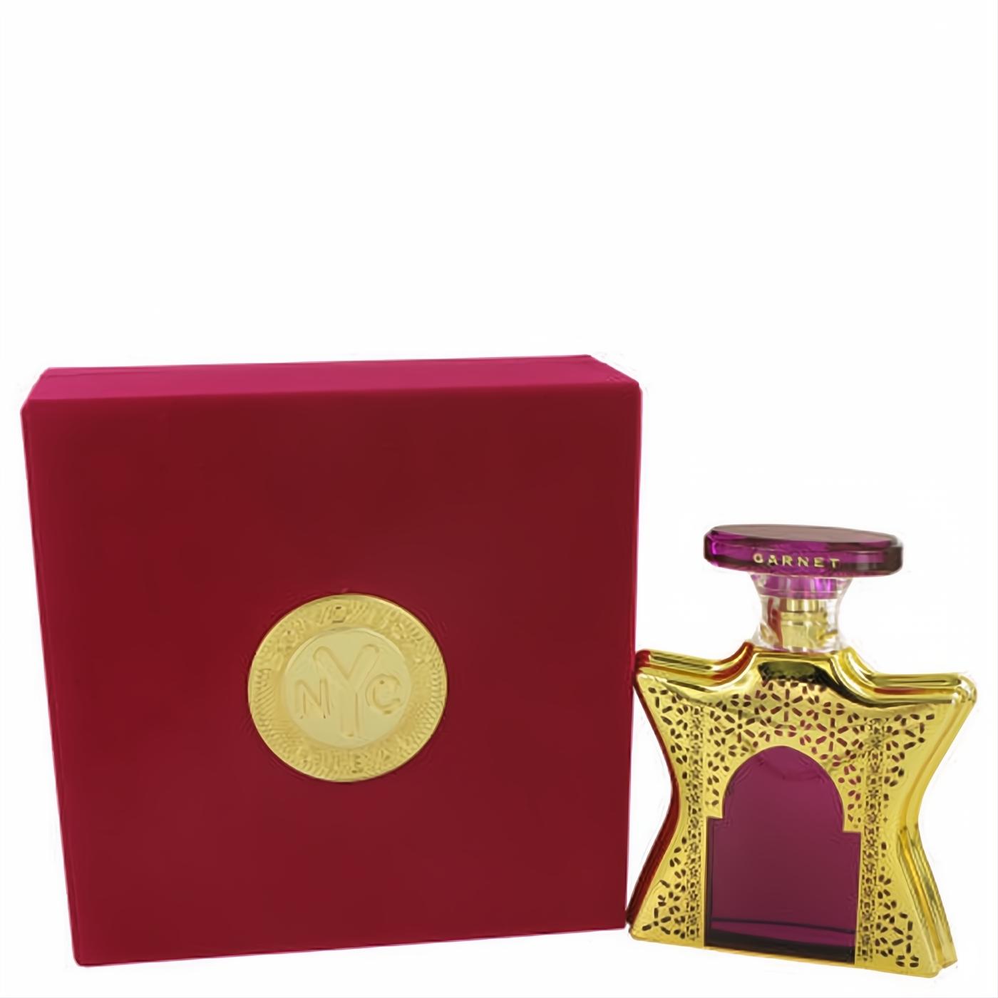 Bond No. 9 Dubai Garnet unisex perfume. Gold filigree star bottle, rich magenta fragrance, vibrant red box with gold NYC seal.