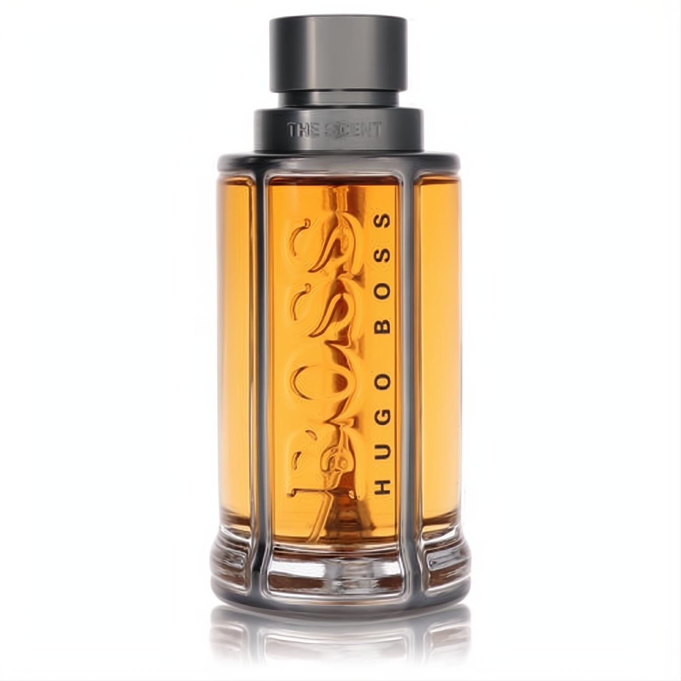 Hugo Boss The Scent men's EDT. Golden amber liquid in a sleek bottle with dark grey cap and metallic BOSS design.