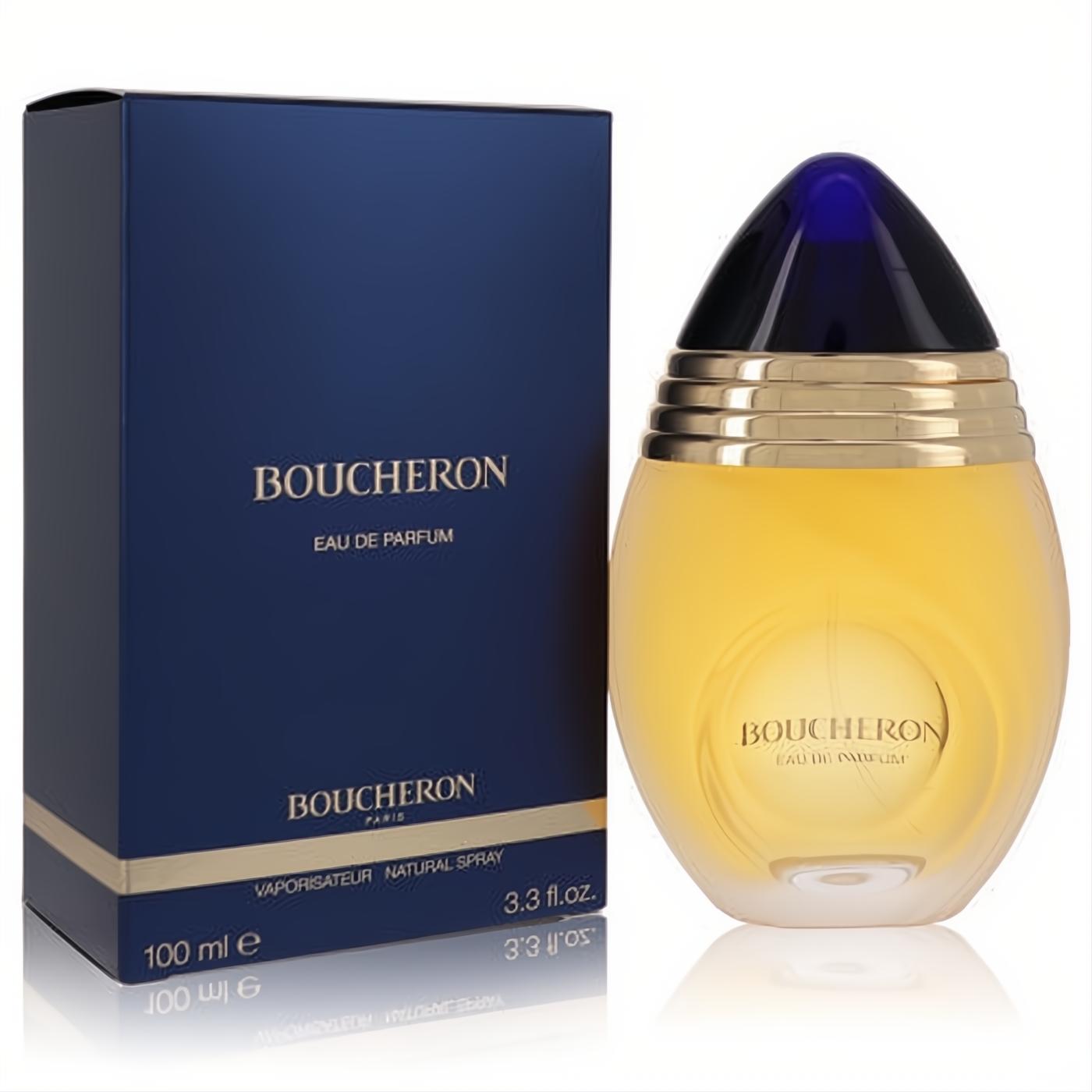 Luxurious Boucheron Eau De Parfum 3.3 oz spray. Golden oval bottle with a striking blue cap, beside its chic navy and gold box.