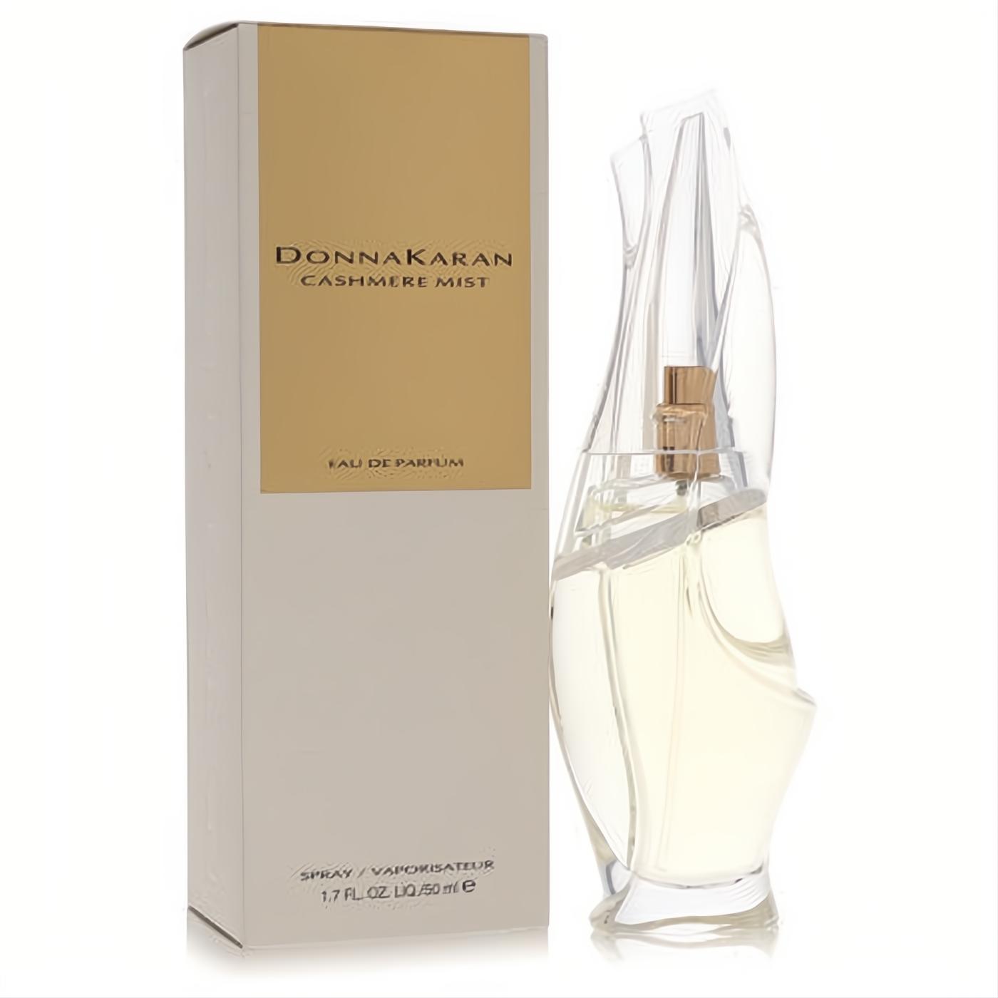 Donna Karan Cashmere Mist 1.7 oz EDP. Elegant clear sculptural bottle with gold accents, displayed with its chic beige box.
