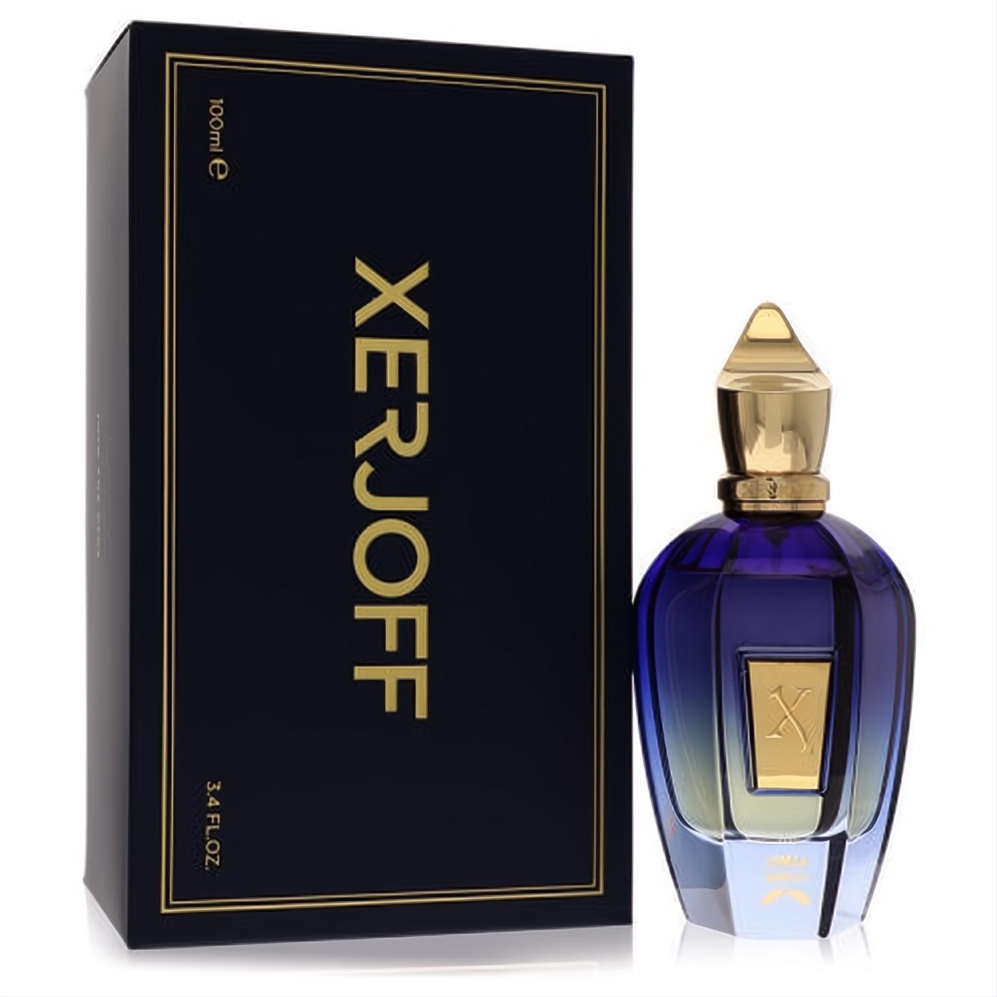 Xerjoff Commandante 3.4 oz unisex EDP. Striking blue-gold gradient bottle with ornate gold cap, next to its elegant dark blue box.