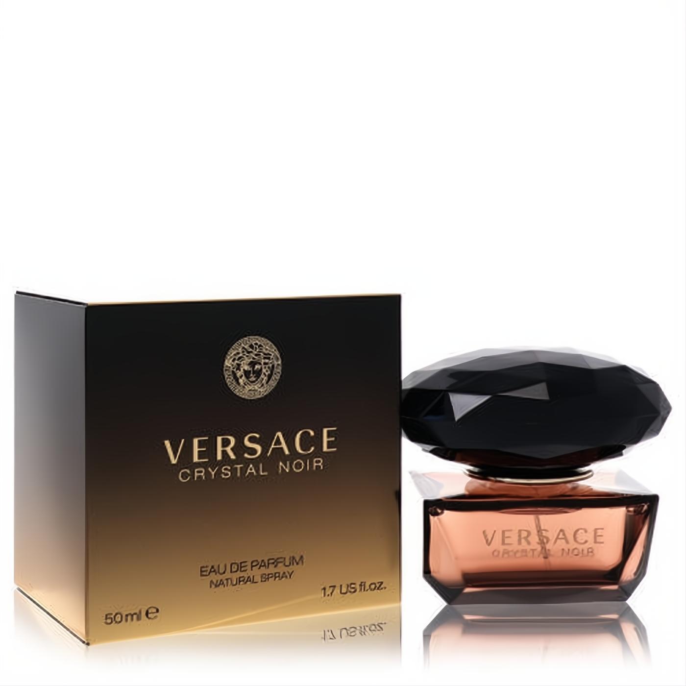 Luxurious Versace Crystal Noir 1.7 oz EDP spray. Amber glass bottle with a faceted black cap and elegant black & gold box.