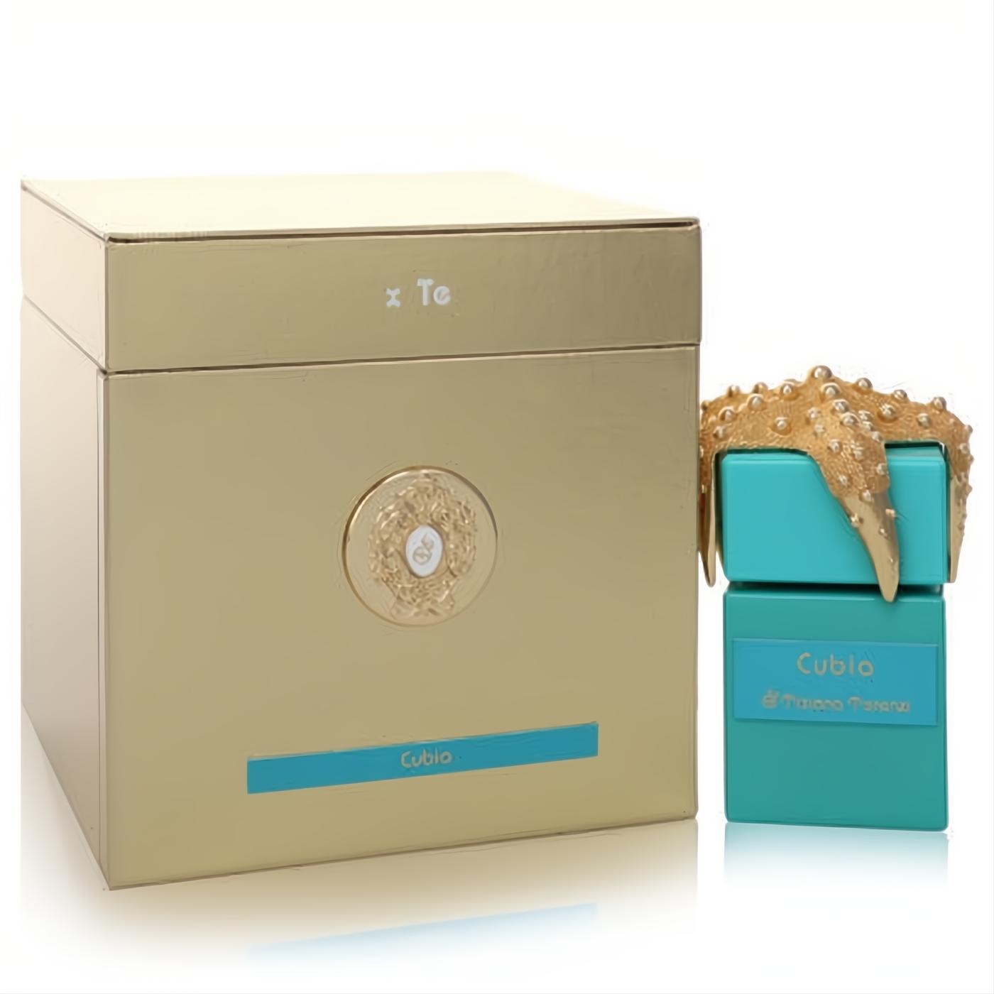 Tiziana Terenzi Cubia unisex perfume: vibrant turquoise bottle with unique gold starfish cap, next to elegant gold gift box.
