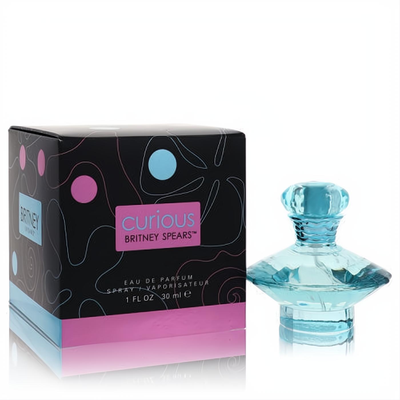 Curious by Britney Spears 1 oz EDP. Alluring light blue glass bottle with a unique, faceted design, next to its vibrant black, pink, and blue box.