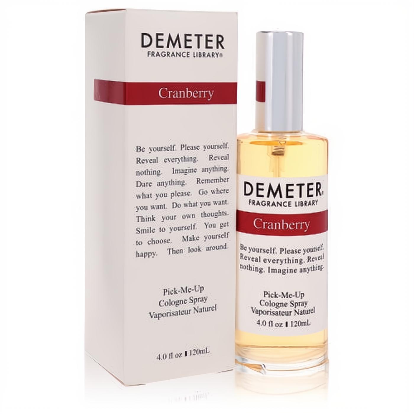 Demeter Cranberry 4 oz cologne spray. Golden liquid in a sleek glass bottle with silver cap, red accent, and elegant white label.