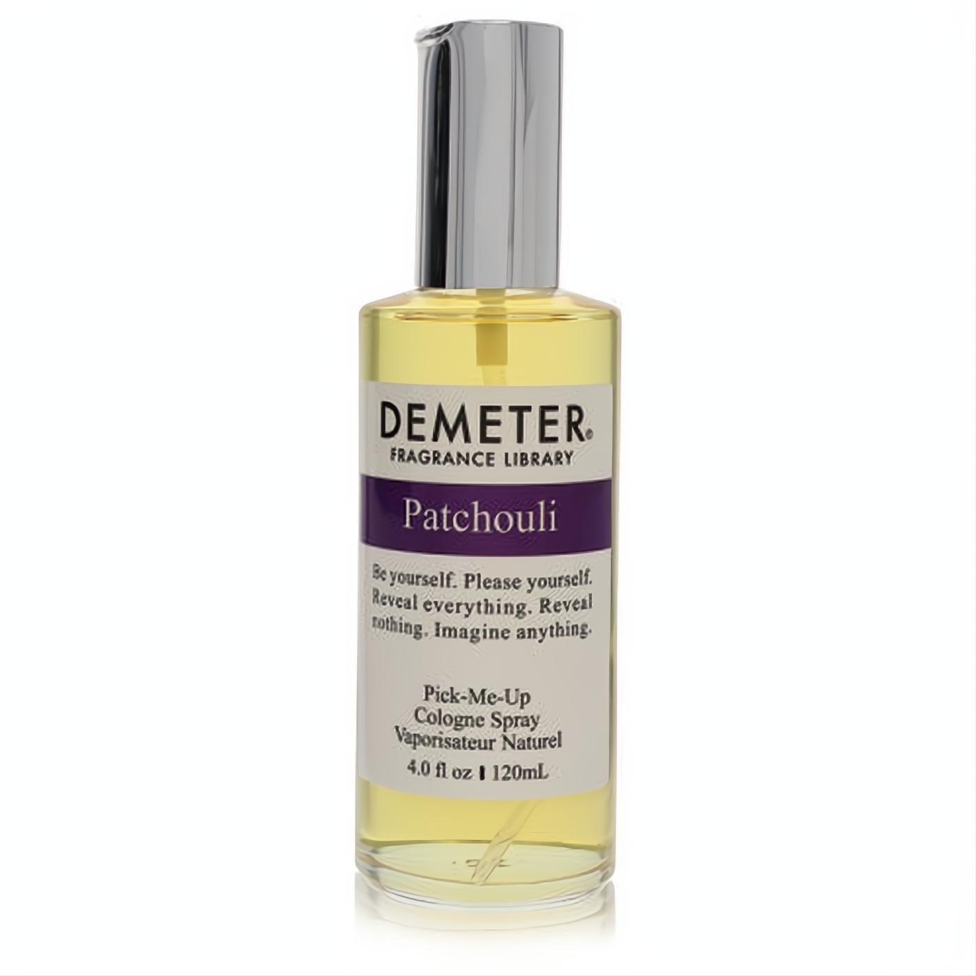 Demeter Patchouli 4 oz cologne spray. Clear glass bottle, golden liquid, sleek silver sprayer, and distinctive purple label.