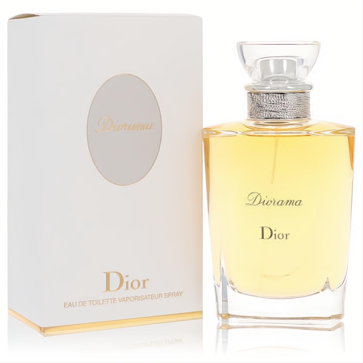 Diorama by Dior Eau De Toilette spray. Elegant clear glass bottle with golden liquid, silver neck, and sophisticated white box with gold accents.
