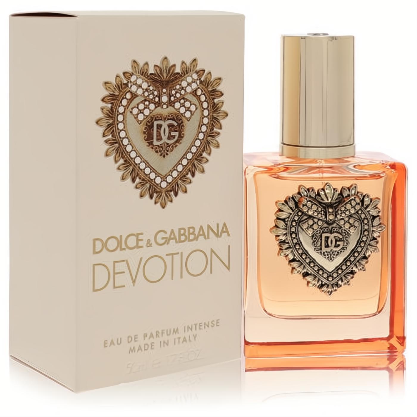 Luxurious Dolce & Gabbana Devotion Intense 1.7 oz EDP. Amber perfume in a clear bottle with an ornate gold DG heart emblem.