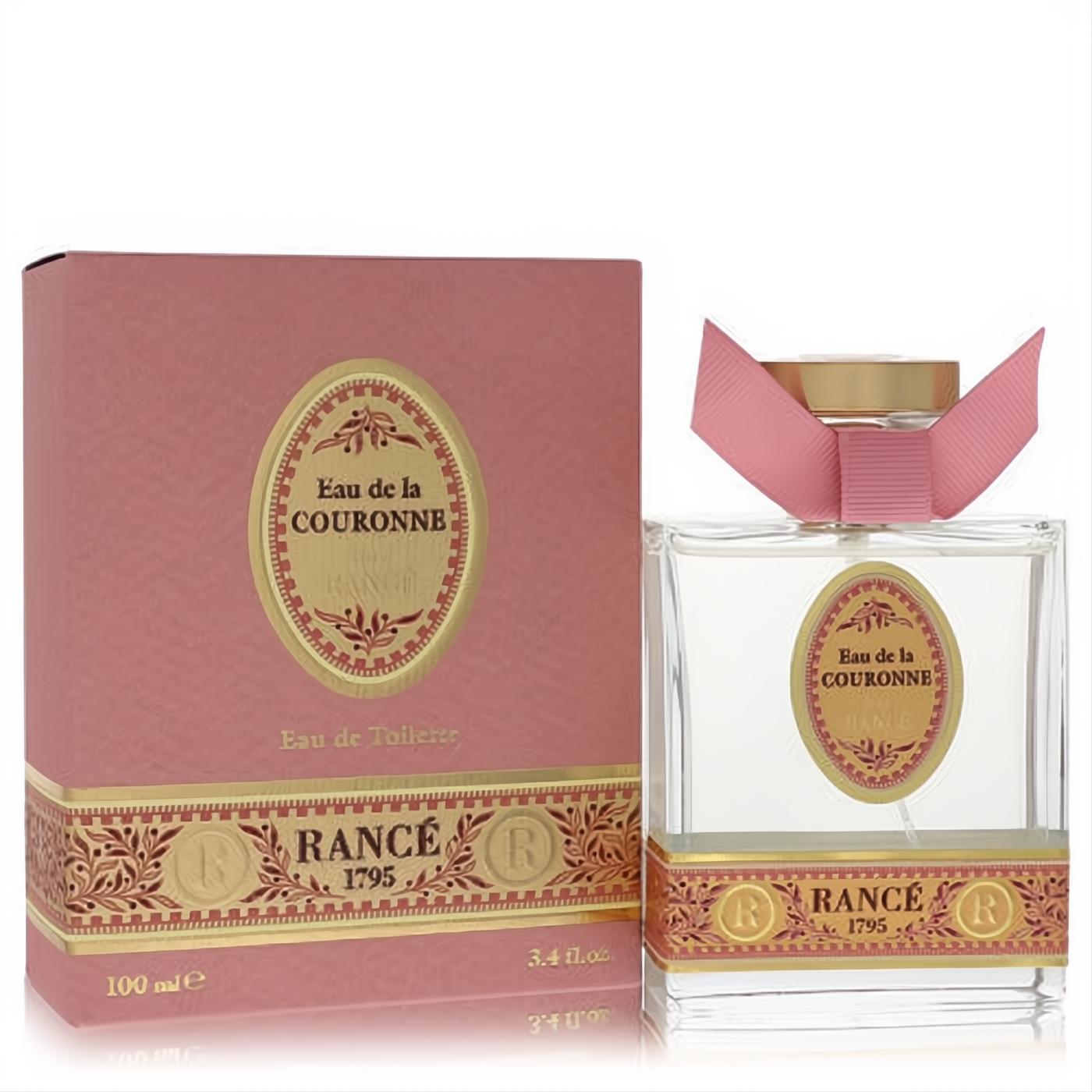Elegant Rance Eau De La Couronne 3.4 oz EDT spray. Clear glass bottle, gold cap, pink ribbon, and ornate rose-pink box.