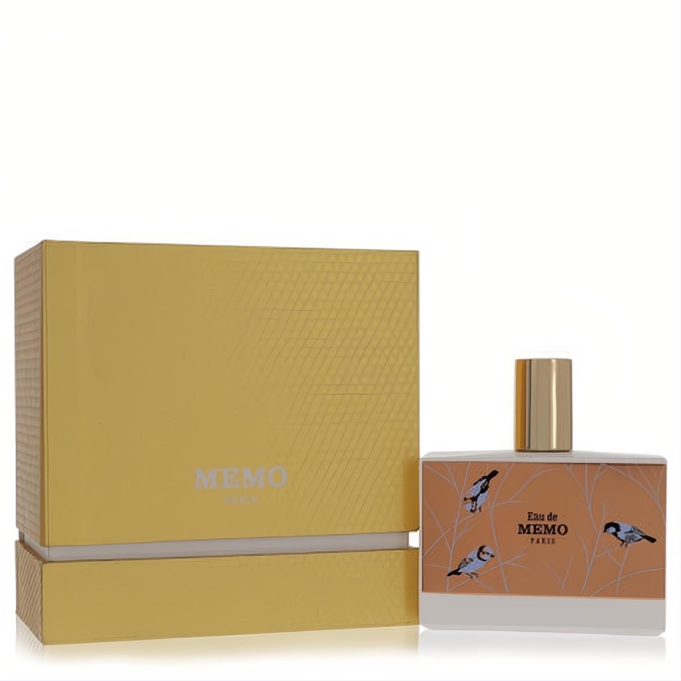 Memo Eau de Memo unisex perfume bottle featuring elegant bird art on a peach label, gold cap, and a luxurious golden box.