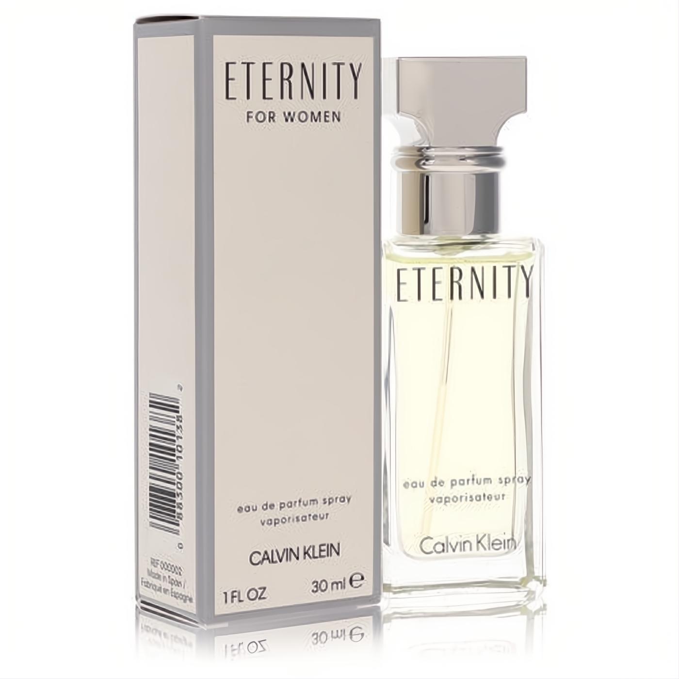 Elegant Eternity by Calvin Klein 1 oz EDP spray. Clear glass bottle with light yellow fragrance, sleek silver cap, beside its chic beige box.