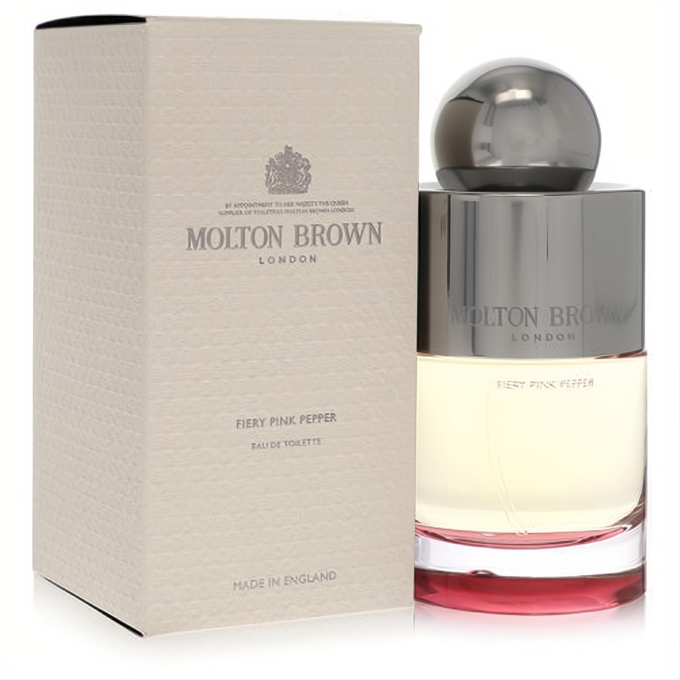 Molton Brown Fiery Pink Pepper EDT spray. Elegant clear glass bottle with a vibrant red base, sleek silver cap, and textured beige box.