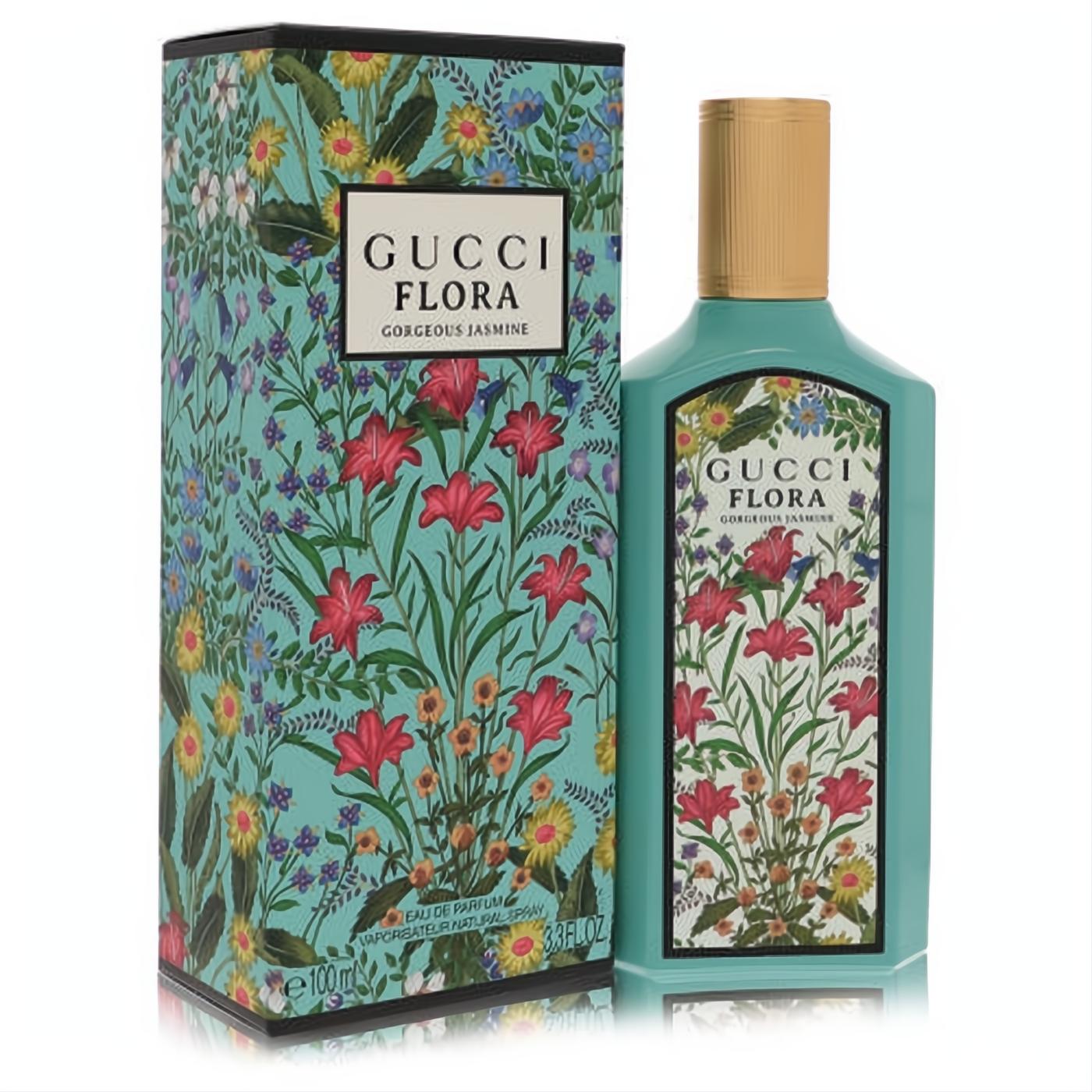 Gucci Flora Gorgeous Jasmine 3.3 oz EDP. Elegant teal bottle with vibrant red, blue, yellow floral print, gold cap, and matching box.