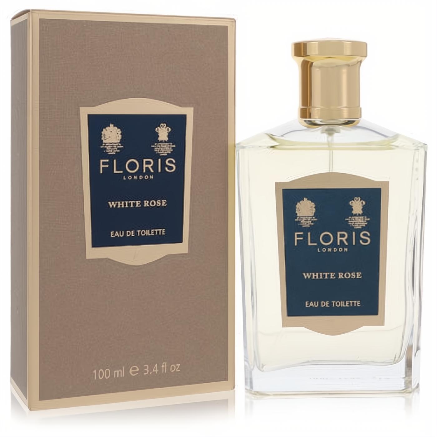 Floris White Rose 3.4 oz Eau De Toilette. Elegant clear glass bottle with gold cap, classic blue label, and sophisticated gold box.