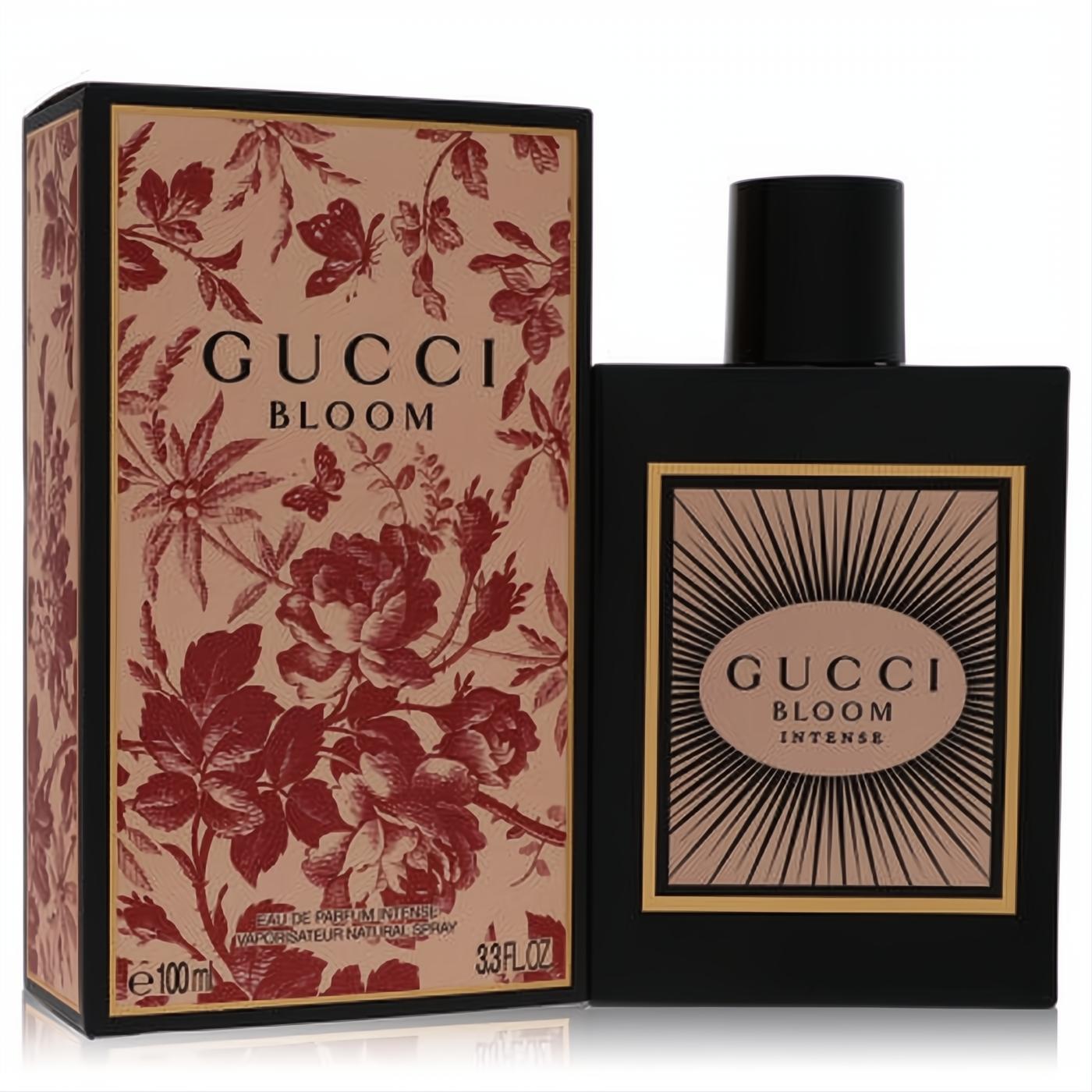 Sleek black Gucci Bloom Intense 3.3 oz EDP bottle with radiant label, beside its ornate floral-patterned box.