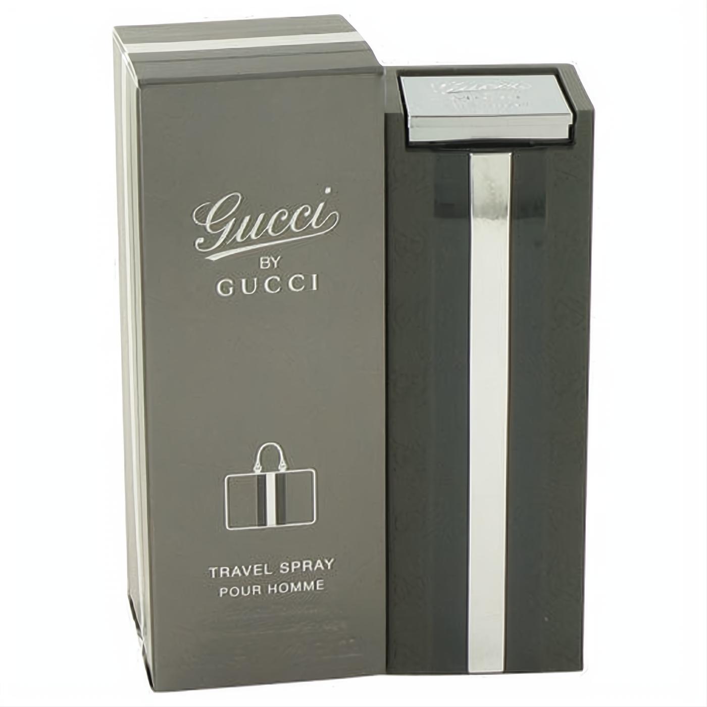 Gucci by Gucci 1 oz men's EDT travel spray. Sleek dark gray bottle with a bold silver stripe and branded box.