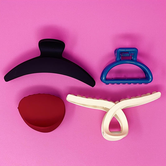 Chic set of 4 matte everyday hair claws in black, royal blue, red, and cream. Includes small/medium & medium/large sizes.