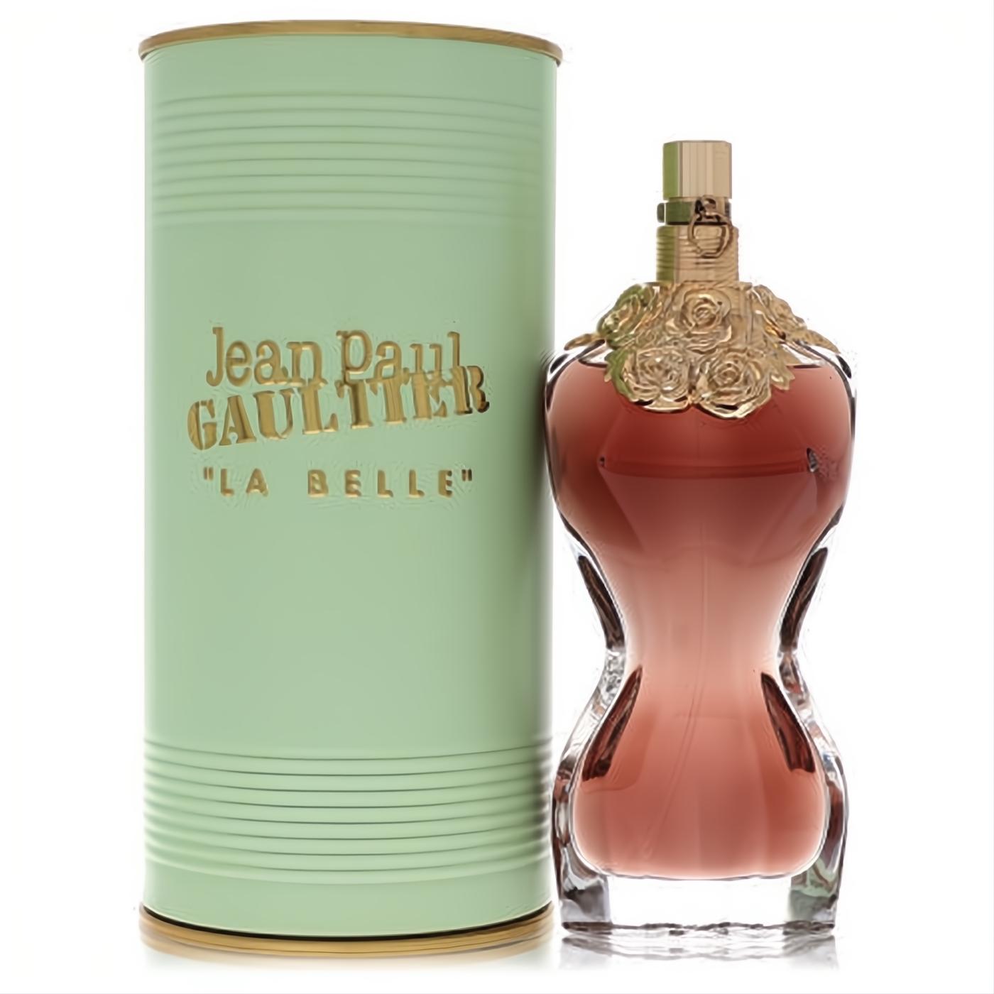 Jean Paul Gaultier La Belle women's perfume: iconic amber torso bottle with gold roses, beside a ribbed mint green canister.