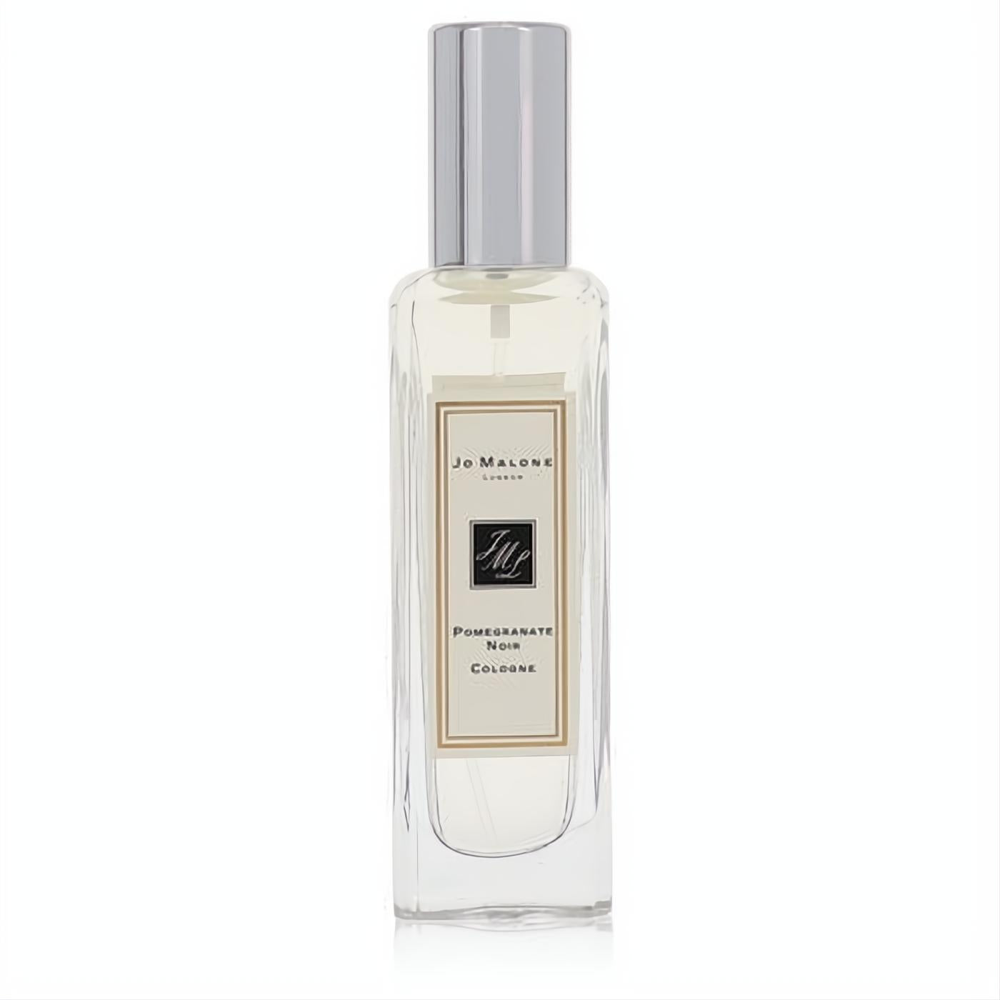 Elegant Jo Malone Pomegranate Noir 1 oz cologne spray. Clear glass bottle, sleek silver cap, and classic cream label.