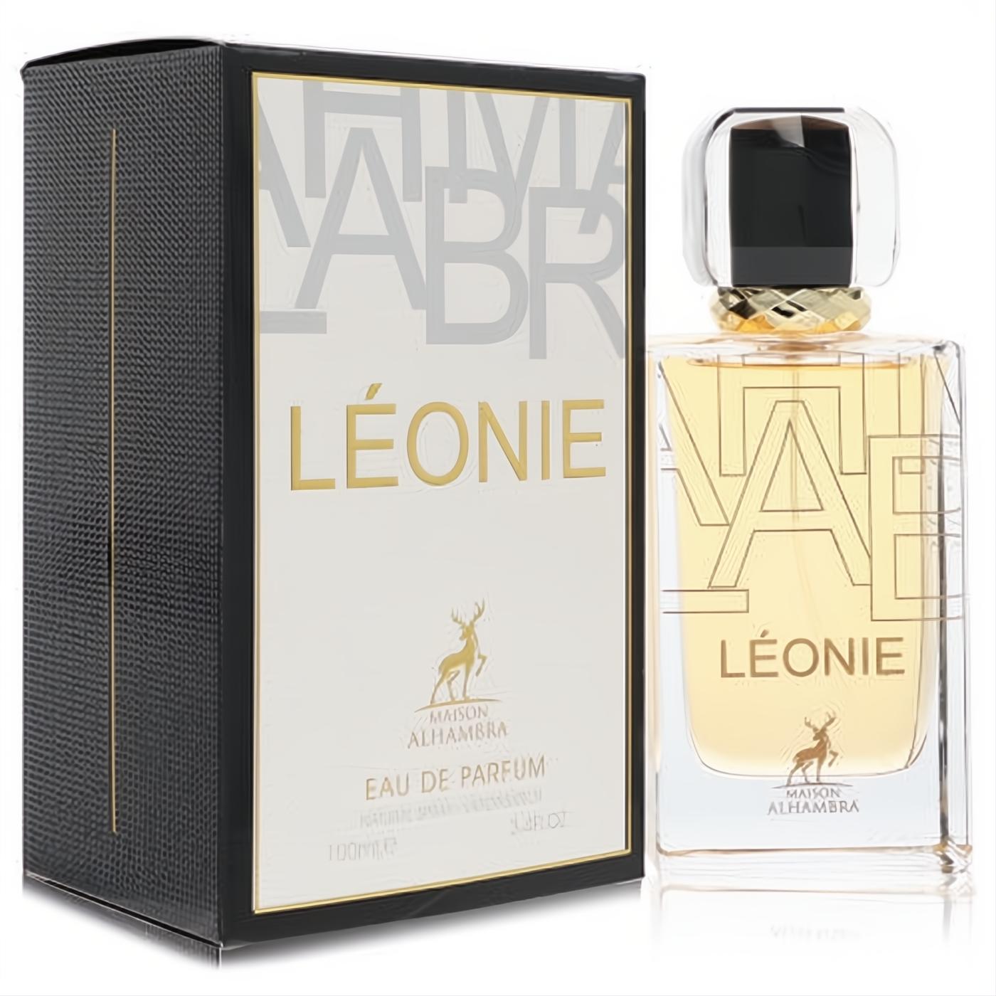 Luxurious Maison Alhambra Leonie 3.4 oz unisex EDP. Sleek clear bottle with gold 'LÉONIE' text and a sophisticated black box.