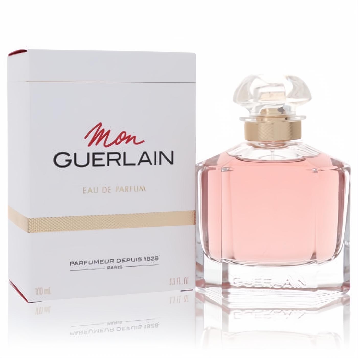 Mon Guerlain 3.3 oz women's Eau De Parfum. Elegant clear glass bottle with delicate pink fragrance, gold neck, and white box.