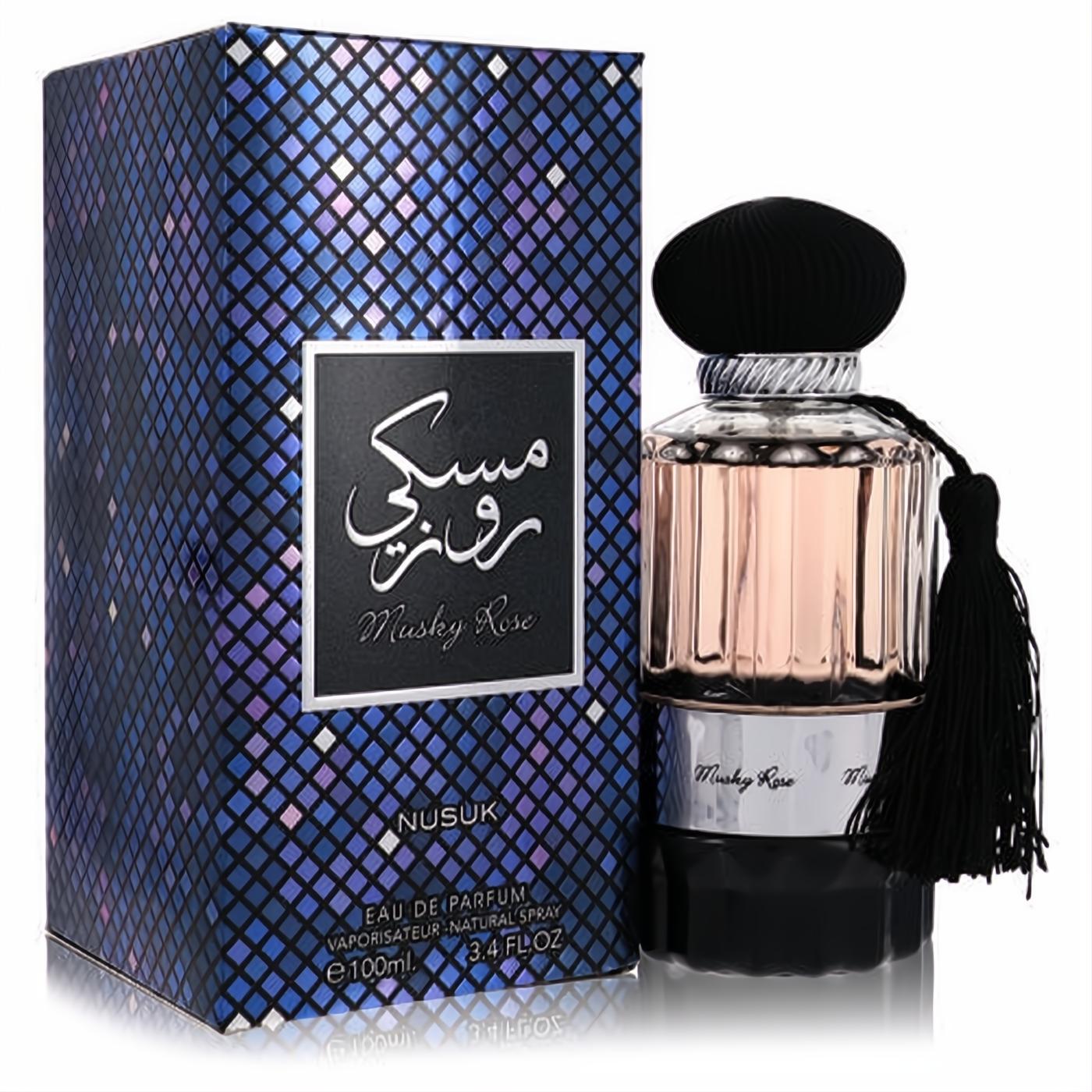Nusuk Musky Rose 3.4 oz EDP. Elegant ribbed glass bottle with rose liquid, black cap, tassel, and shimmering blue mosaic box.