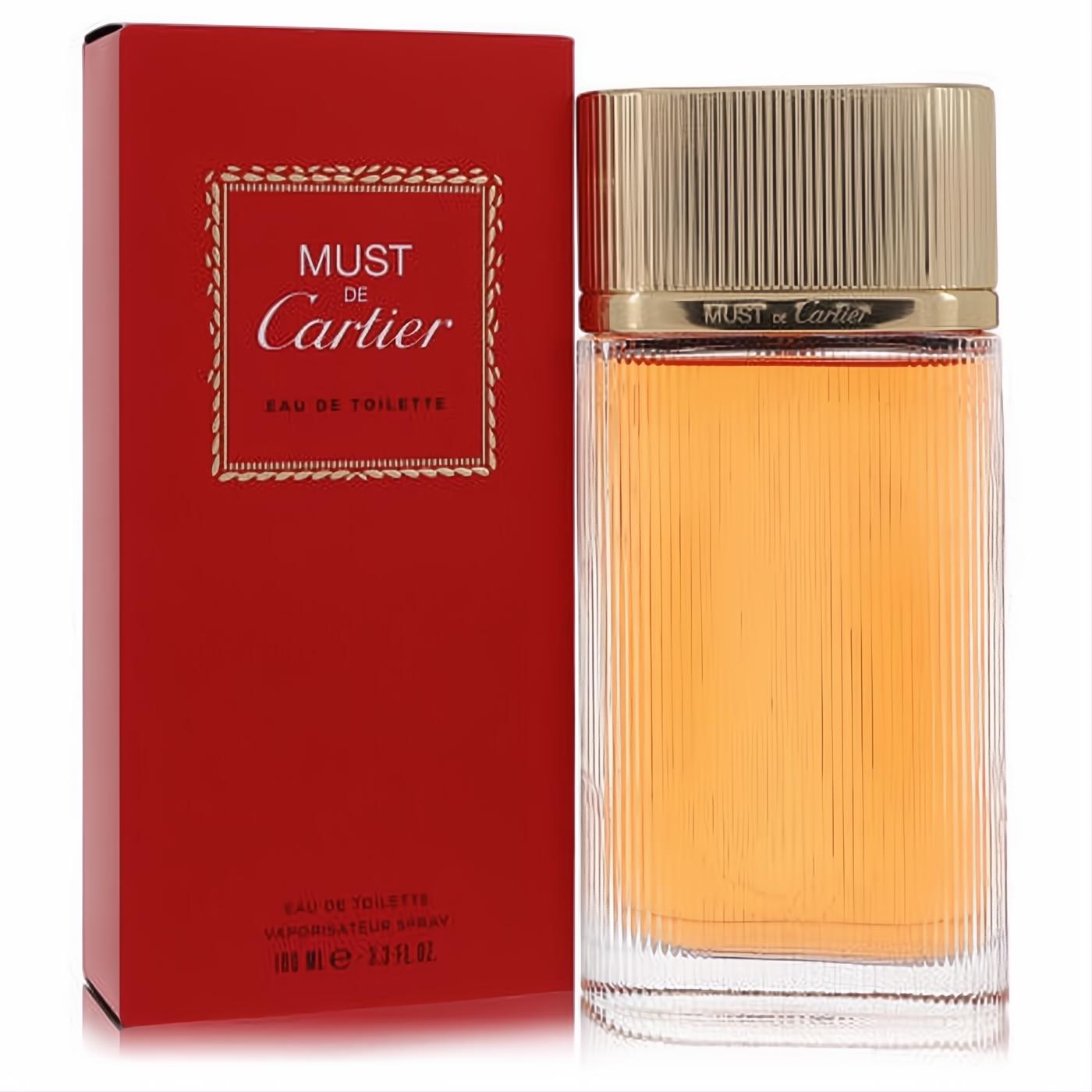Must De Cartier 3.3 oz Eau De Toilette spray in a clear ribbed bottle with a luxurious gold cap, beside its elegant red and gold box.