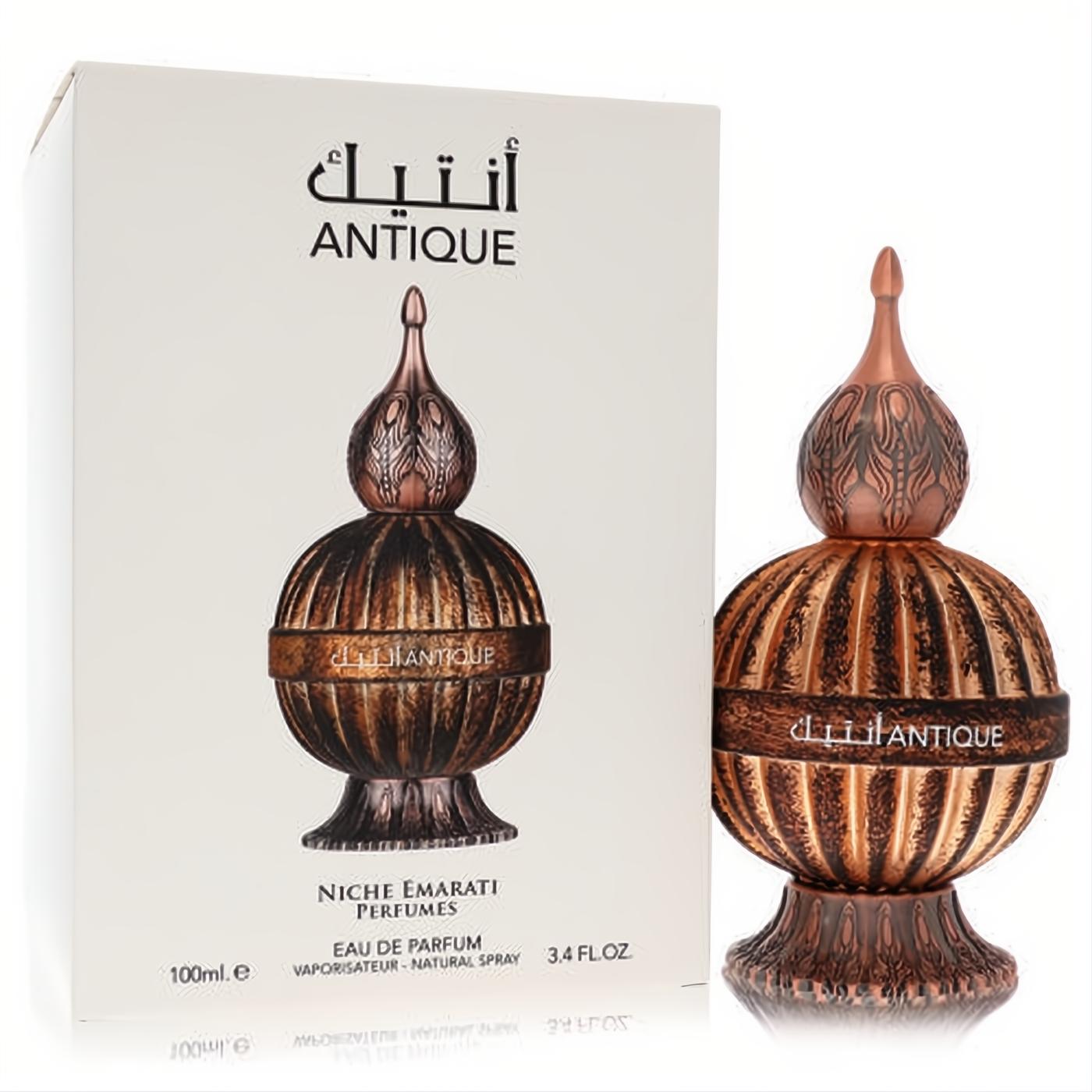 Exquisite Niche Emarati Antique Lattafa 3.4 oz unisex EDP. Ornate bronze globe bottle with intricate finial and white packaging.