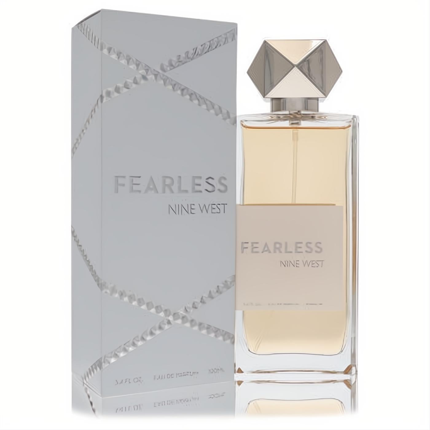 Elegant Nine West Fearless 3.4 oz Eau De Parfum. Clear bottle with golden liquid, striking silver geometric cap, and textured silver box.