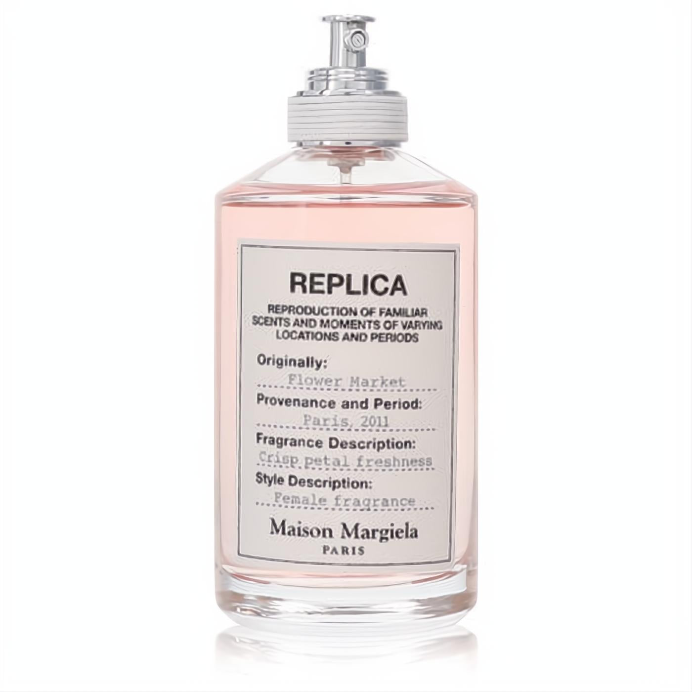 Experience Replica Flower Market EDT. Chic clear glass bottle, delicate pink fragrance, silver sprayer, and signature Maison Margiela label.