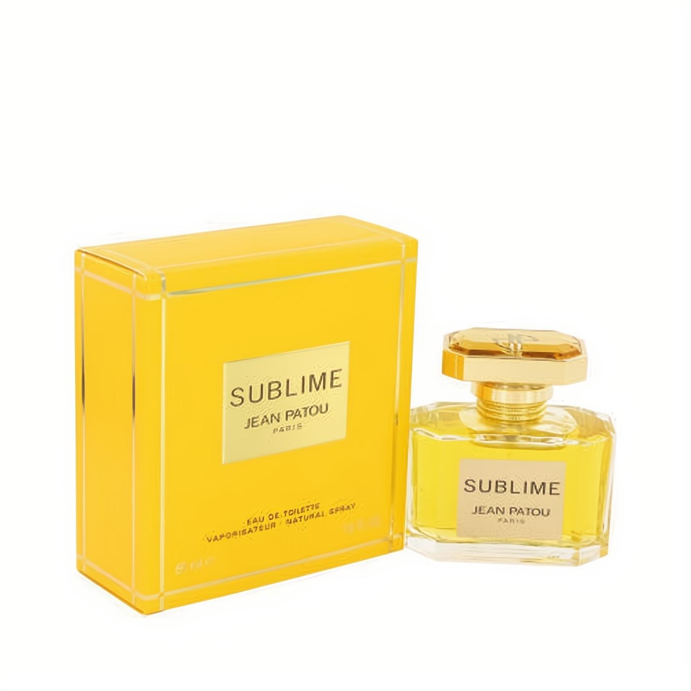 SUBLIME by Jean Patou Eau De Toilette. Luxurious clear glass bottle with gold cap and label, paired with a vibrant yellow box.