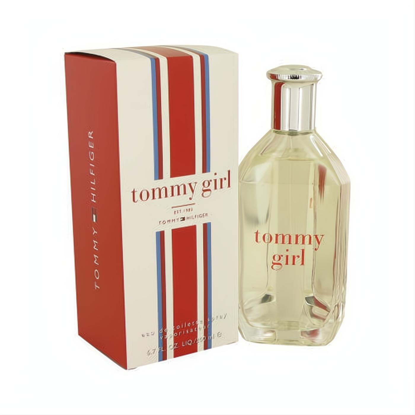 Tommy Girl 6.7 oz Eau De Toilette spray. Clear glass bottle with silver cap and red band, beside its iconic red, white, and blue striped box.