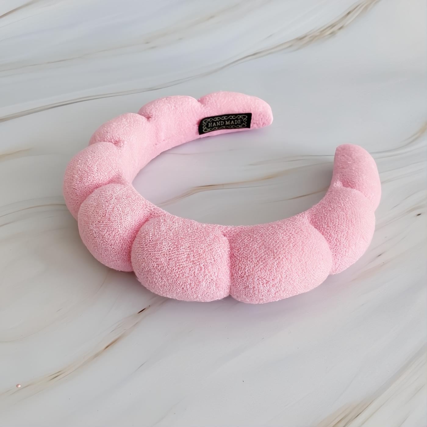 Luxurious pink terry cloth headband with a soft, puffy scalloped design. Handmade for ultimate comfort and style.