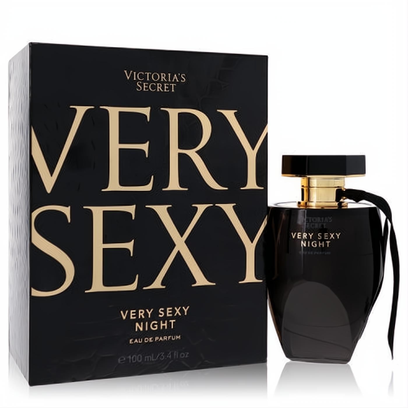 Victoria's Secret Very Sexy Night 3.4 oz Eau de Parfum. Sleek black bottle with gold accents and ribbon, beside its elegant black and gold box.