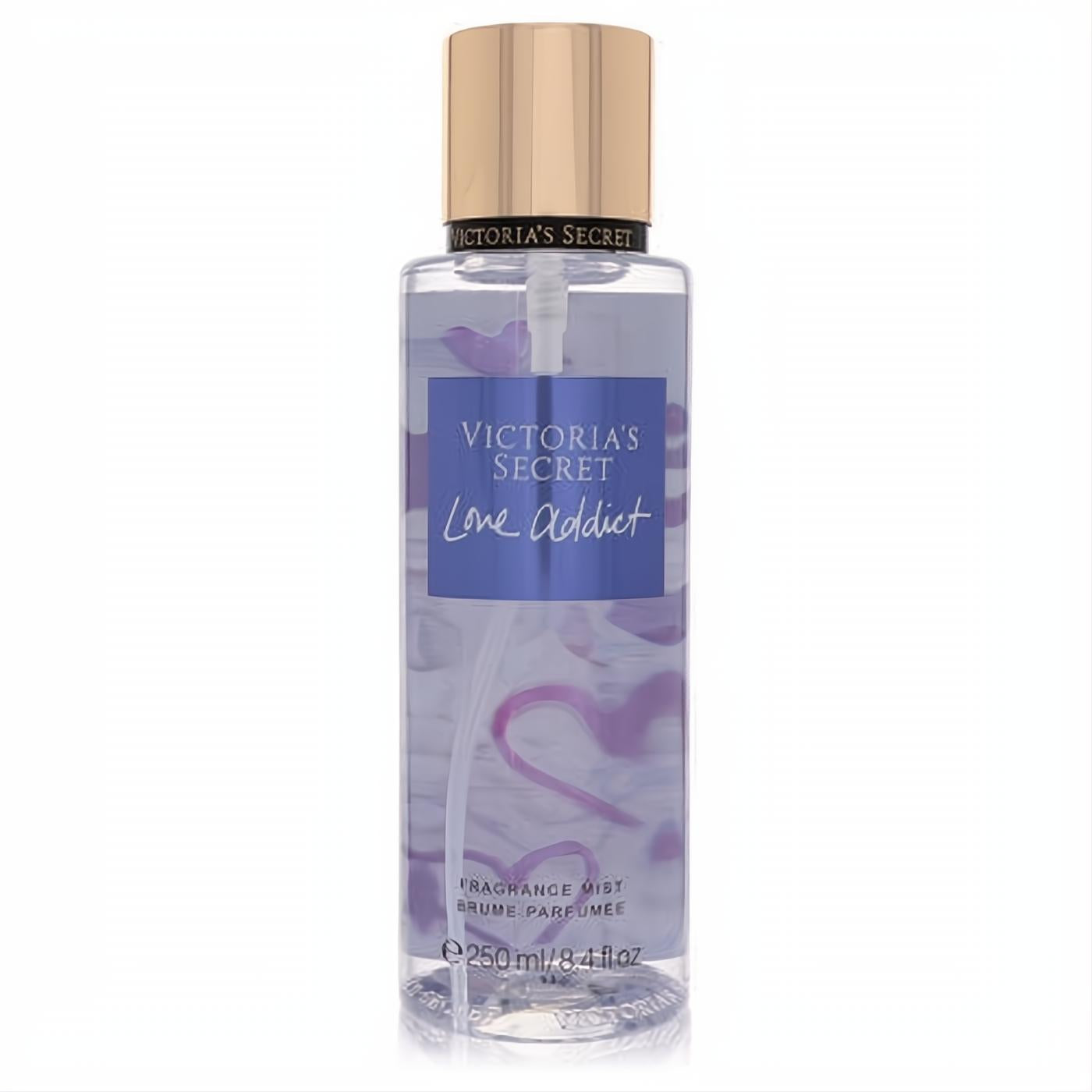 Victoria's Secret Love Addict women's 8.4 oz fragrance mist. Clear bottle, purple liquid, gold cap, and romantic heart design.