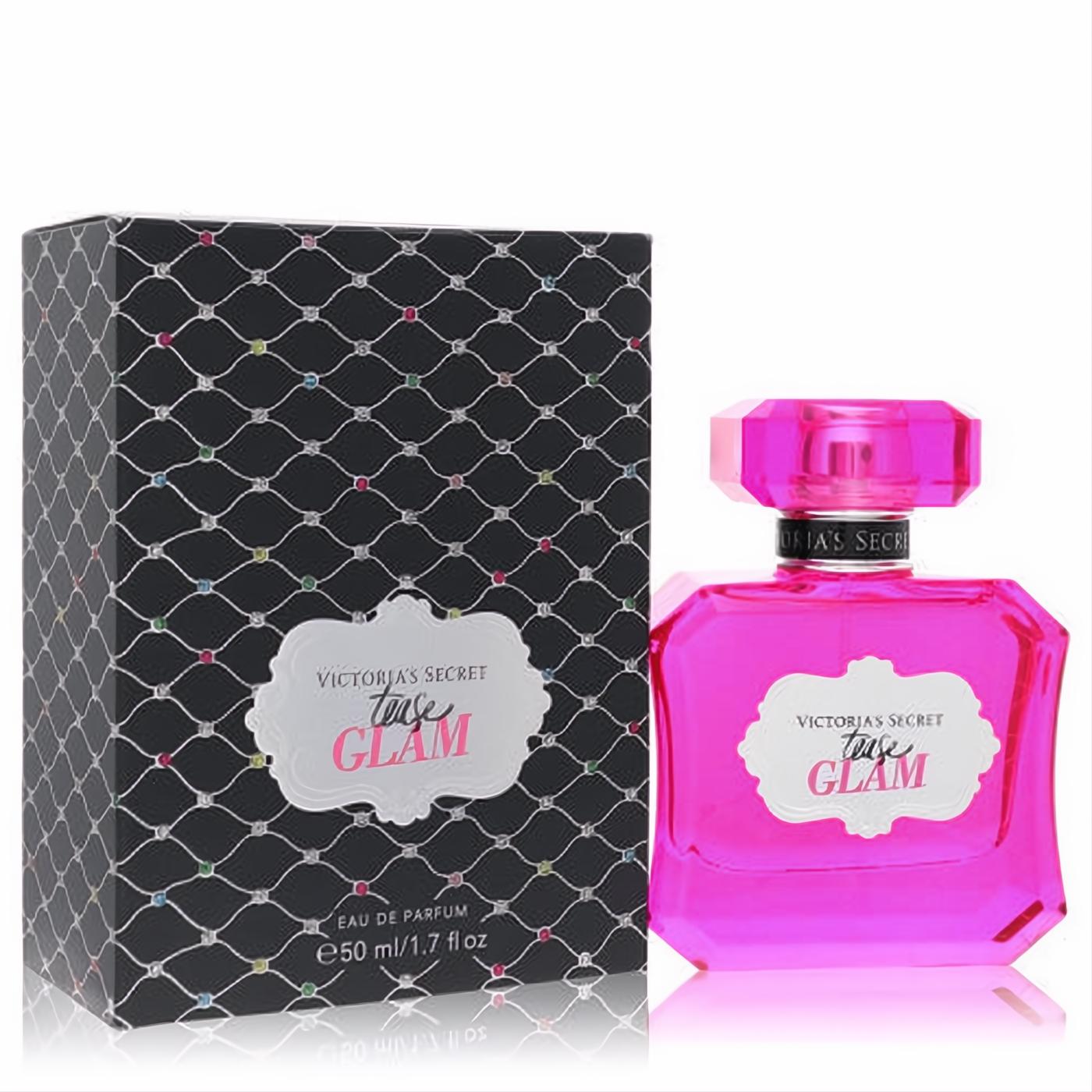 Vibrant fuchsia Victoria's Secret Tease Glam 1.7 oz EDP bottle with faceted cap and sparkling black patterned box.