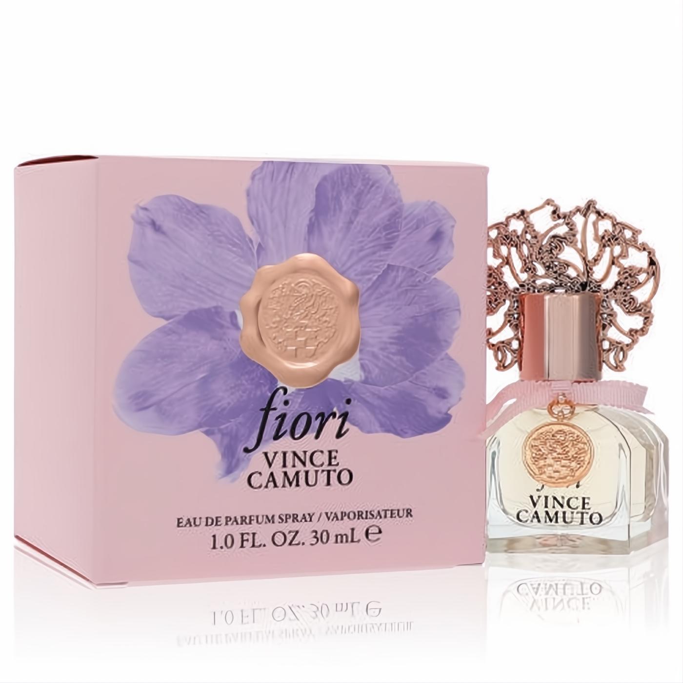 Elegant Vince Camuto Fiori 1 oz EDP perfume: clear glass bottle, rose gold cap, ornate filigree, pink ribbon, and matching floral box.