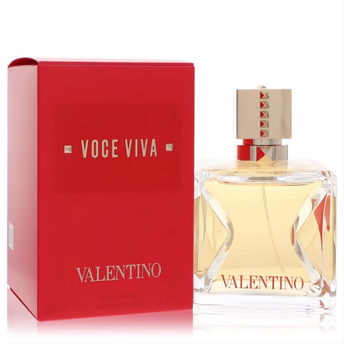 Valentino Voce Viva 3.38 oz Eau De Parfum. Clear glass bottle with V-cutouts, gold studded cap, and vibrant red box.