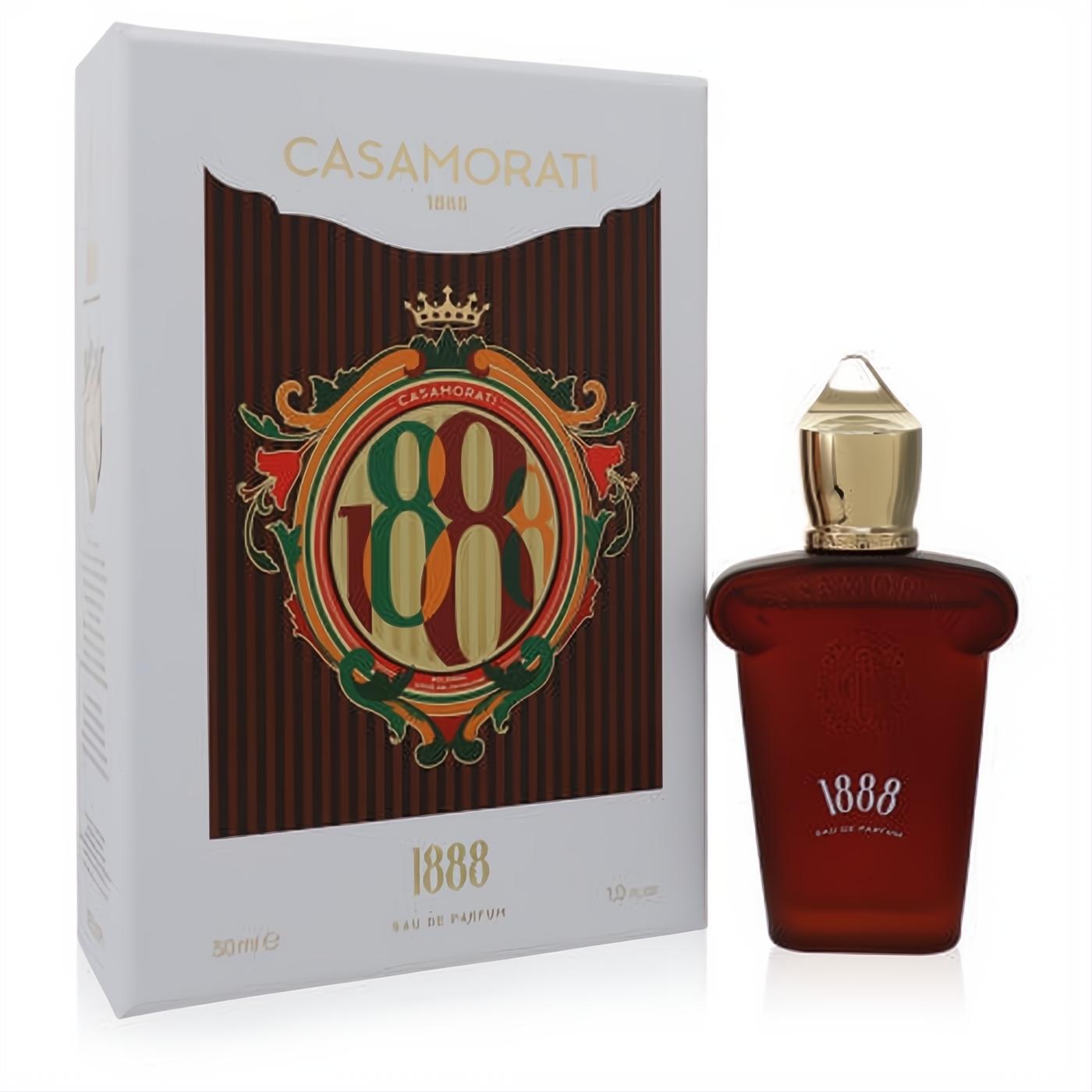 Elegant 1888 Casamorati Xerjoff 1 oz unisex Eau De Parfum. Rich amber bottle with gold cap, displayed with its ornate white and gold box.