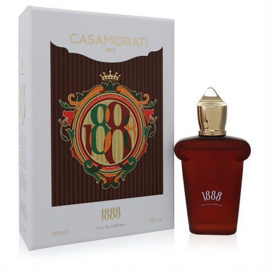 Elegant 1888 Casamorati Xerjoff 1 oz unisex Eau De Parfum. Rich amber bottle with gold cap, displayed with its ornate white and gold box.