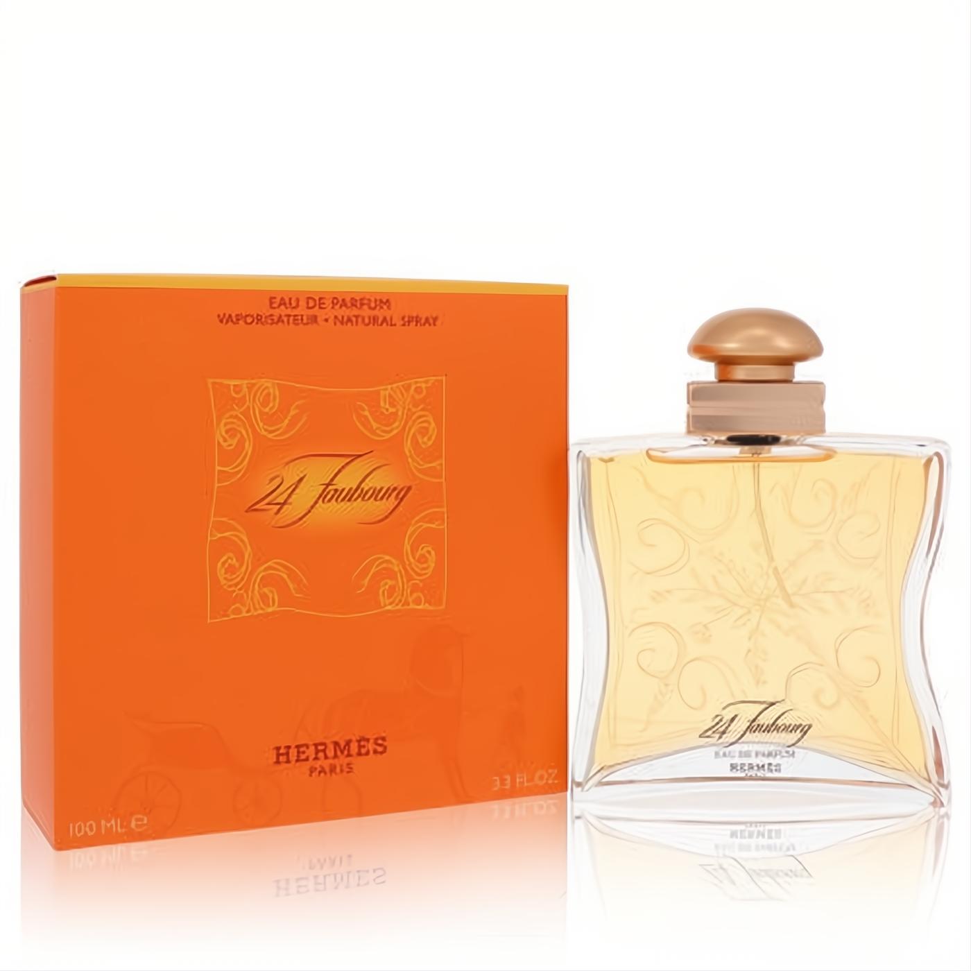 Hermes 24 Faubourg 3.3 oz EDP spray. Elegant clear glass bottle with gold cap, intricate design, and vibrant orange box.