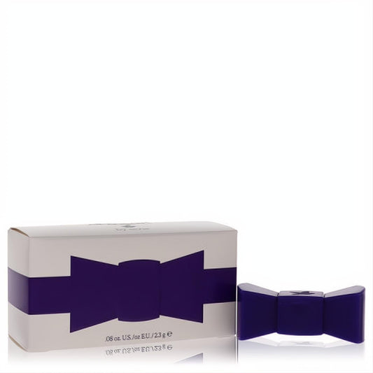 Elevate your scent with Abigail by Aerie .08 oz solid perfume, a dark purple bow tie container beside its elegant white box.