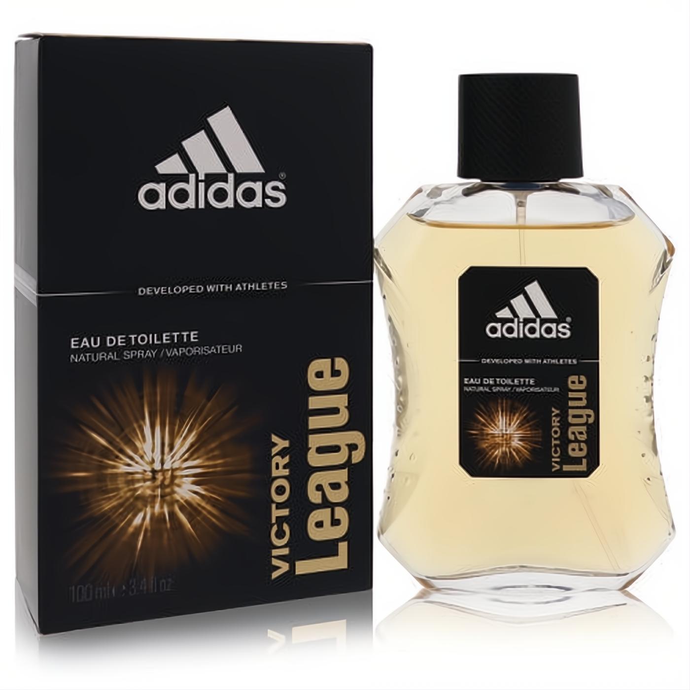 Dynamic Adidas Victory League 3.4 oz Eau De Toilette spray for men. Amber fragrance in a sleek clear glass bottle with a bold black and gold box.